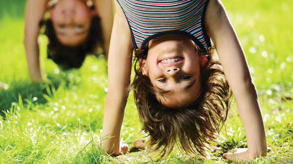 image of children doing handstands