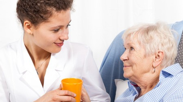 Image of an elderly woman and her caretaker. Image credit: GIS