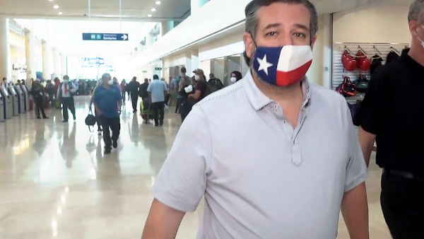Sen. Ted Cruz at an airport 
        for a flight to Cancún, Mexico while many Texans are trapped and freezing without power from winter storms